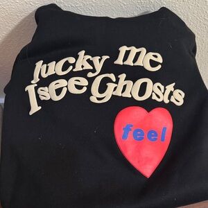 Yeezy Black Hoodie with Cream, Red, and Blue Graphics